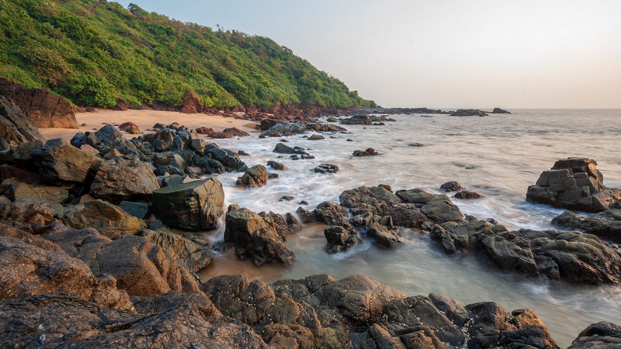 Rocky Goa coastline at sunset